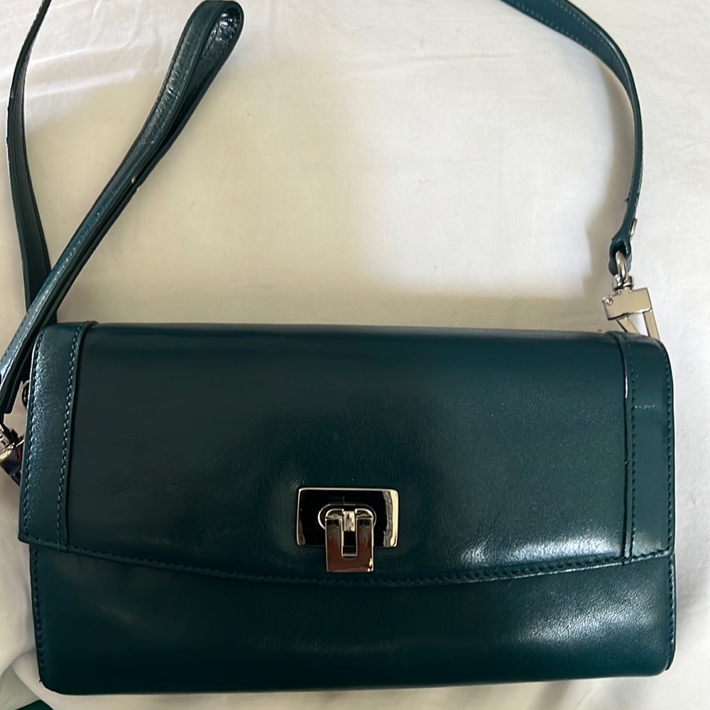 Nordstrom’s dark green clutch/wristlet. Like new. Tons on interior compartments.
